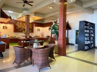 a lobby with a table and chairs and a bookstore at Koh Chang Bailan Beach Resort in Ko Chang