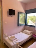 Posteľ alebo postele v izbe v ubytovaní Theros house