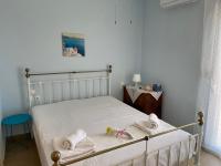 Posteľ alebo postele v izbe v ubytovaní Theros house