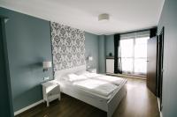Posteľ alebo postele v izbe v ubytovaní RENTTNER Apartamenty