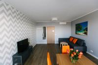 Televízia a/alebo spoločenská miestnosť v ubytovaní RENTTNER Apartamenty