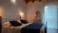 Cama o camas de una habitación en B&B Al sogno di Laura