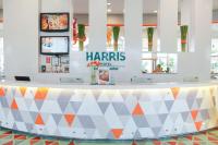 a reception counter in a fast food restaurant at HARRIS Hotel Batam Center in Batam Center