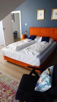Posteľ alebo postele v izbe v ubytovaní Uroczy Penthouse