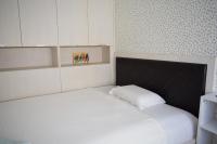 Postel nebo postele na pokoji v ubytování Apartment with 2 Bedrooms and Parking Near the Beach
