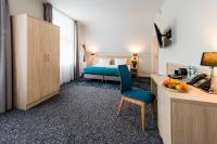 Łóżko lub łóżka w pokoju w obiekcie Hotel Eureka