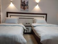Postel nebo postele na pokoji v ubytování Delta Sharm Chalets