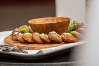 a plate of food with a bowl on a table at Hôtel La Rose Blanche Korhogo in Korhogo