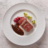 a plate of food with meat and vegetables on it at Hotel Yellowstone at Jackson Hole in Jackson