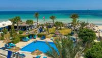 an aerial view of a resort with a swimming pool and the beach at Hotel de charme et SPA Dar El Bhar in Mezraya