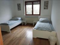 Postel nebo postele na pokoji v ubytování L8 Ferienwohnung - Stuttgart Renningen