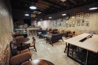 a restaurant with tables and chairs in a room at Dé Cafe & Rest House in Ipoh