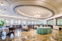 a dining room with tables and chairs and a ceiling at Shanghai Donghu Hotel - Shanghai Style Garden House in Shanghai