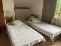 Łóżko lub łóżka w pokoju w obiekcie Chalet Les Airelles
