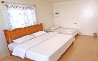 Postel nebo postele na pokoji v ubytování The Golden View Resort สวนผึ้ง