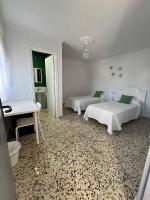 A bed or beds in a room at Alojamientos La Menúa