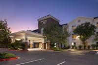 una representación de la parte delantera de un hotel con aparcamiento en SpringHill Suites by Marriott Turlock, en Turlock