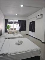 Postel nebo postele na pokoji v ubytování Loft 21 Apartment Romklao