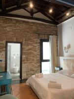 Posteľ alebo postele v izbe v ubytovaní C&O Savoia Deluxe Rooms