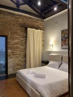 Posteľ alebo postele v izbe v ubytovaní C&O Savoia Deluxe Rooms