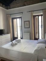 Posteľ alebo postele v izbe v ubytovaní C&O Savoia Deluxe Rooms