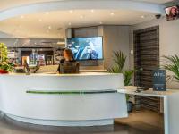 Televízia a/alebo spoločenská miestnosť v ubytovaní Novotel Suites Malaga Centro