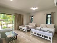 Postel nebo postele na pokoji v ubytování Rainbow Bungalow Haadrin Koh Phangan