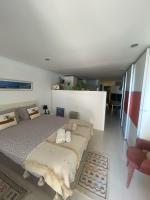 Postel nebo postele na pokoji v ubytování São João Beach Lounge