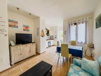 Televízia a/alebo spoločenská miestnosť v ubytovaní Familyhouse Pevero Hill Porto Cervo