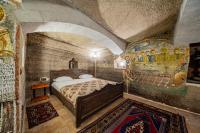 Postel nebo postele na pokoji v ubytování Chelebi Cave House