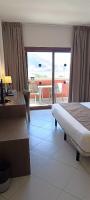 Posteľ alebo postele v izbe v ubytovaní Ohtels Campo De Gibraltar