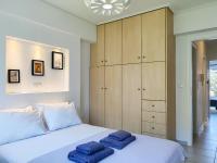 Posteľ alebo postele v izbe v ubytovaní KYMA Apartments - Athens Acropolis 13
