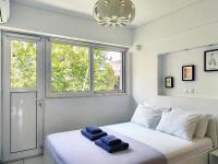Posteľ alebo postele v izbe v ubytovaní KYMA Apartments - Athens Acropolis 13