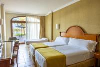 A bed or beds in a room at Hotel IPV Palace & Spa - Adults Recommended