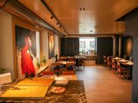 a restaurant with a dining room with tables and chairs at Dogan's Langenthal in Langenthal