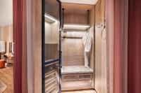 a walk in closet with a glass door at W Dubai - Mina Seyahi in Dubai