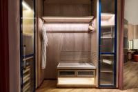 a walk in closet with a glass door at W Dubai - Mina Seyahi in Dubai