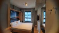 Astron Suítes Mondial Salvador by Nobileにあるベッド