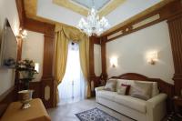 A bed or beds in a room at Rome Imperial Crown