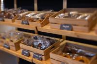 a group of wooden boxes filled with different types of food at Royal Phuket City Hotel in Phuket Town