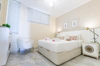 A bed or beds in a room at Apartment in beachfront complex in El Duque area, Costa Adeje