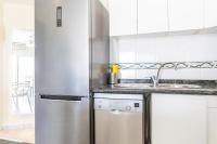 A kitchen or kitchenette at Apartment in beachfront complex in El Duque area, Costa Adeje