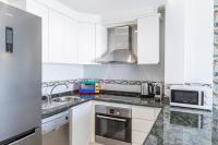 A kitchen or kitchenette at Apartment in beachfront complex in El Duque area, Costa Adeje