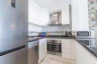 A kitchen or kitchenette at Apartment in beachfront complex in El Duque area, Costa Adeje