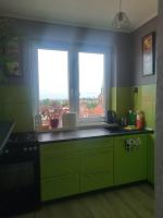Kuchyňa alebo kuchynka v ubytovaní Apartament Długie Ogrody 2 pokojowy
