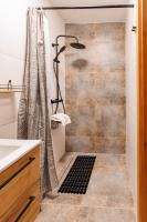 a bathroom with a shower and a sink at Panorama Górska Wisła Resort & SPA in Wisła
