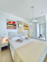 A bed or beds in a room at Koumaros Aparthotel