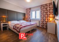 Posteľ alebo postele v izbe v ubytovaní Arion Airport Hotel