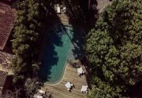 an overhead view of a swimming pool in a yard with trees at Pousada Capim Santo in Trancoso