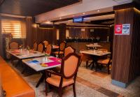 Χώρος καθιστικού στο Golden Tulip Garden City Hotel - Rivotel